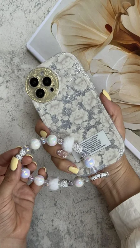 کاور آیفون گل مستر پیس سفید نقره ای + بندست مخملی