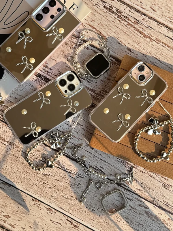 قاب گوشی آیفون آینه ای پاپیون مرواریدی با آویز
